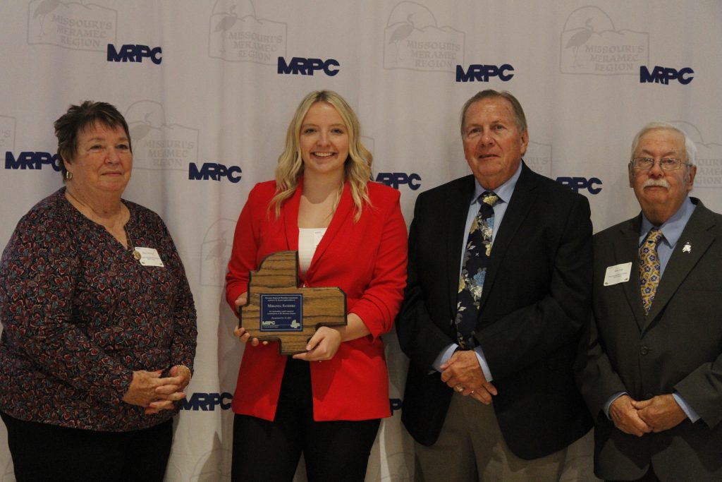 Miranda Sanders, of Belle, was presented with an Youth Outstanding Community Service Award, by MRPC Board Chair Mary Heywood (left) and Vice Chair Darryl Griffin (second right) at the 2024 Annual Dinner and Awards Banquet on Oct. 24 in Linn. Sanders was nominated by MRPC Board Member Steve Vogt (right), who represents Belle. 